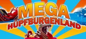 Drei bunte Hüpfburgen mit Tiermotiven vor sonnigen blau gelben Strahlen